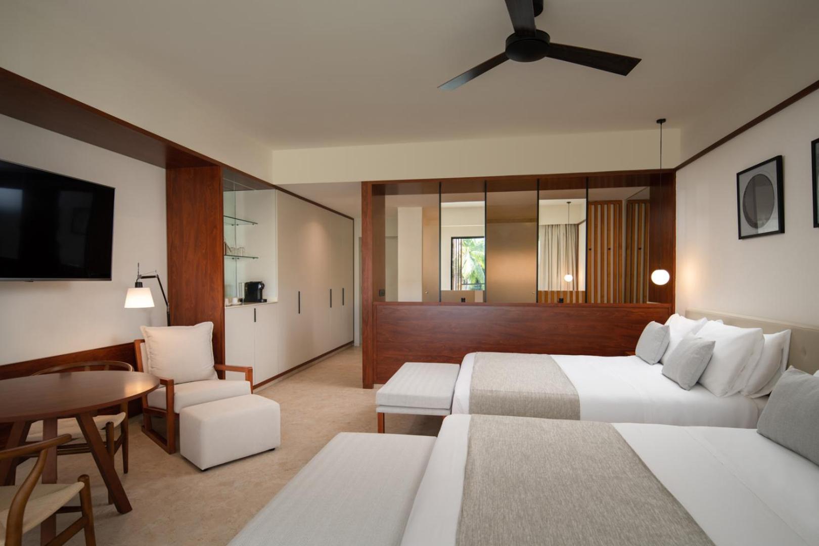 Suíte Júnior Deluxe com Vista Piscina e 2 Camas de Casal